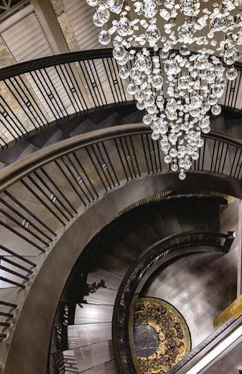 Spiral Staircase With Chandelier - Riverview Custom Homes
